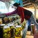 Jenny's Farm Market manager Jessica Reeve stocks some of their many varieties of canned goods inside the market, located at the corner of Island Lake Road and Dexter-Pinckney Road just outside Dexter on Wednesday. Melanie Maxwell I AnnArbor.com